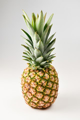 Fototapeta premium Pineapple isolated on white. Space for text or design.