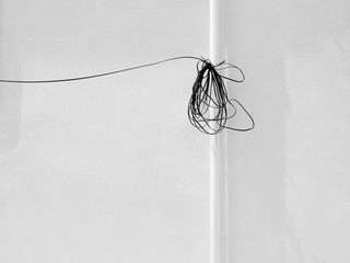 white wall with wire cable