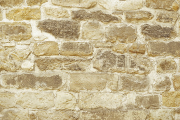 Beige stone mosaic wall background