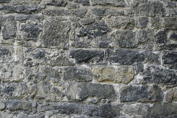 Grey stone mosaic wall background