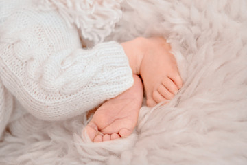 Fototapeta na wymiar Photo of newborn baby feet, soft focus.