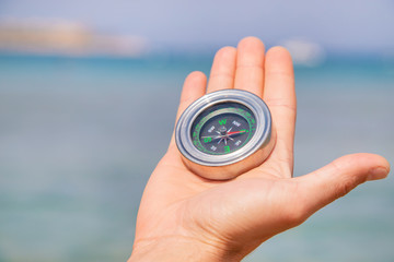 compass on the sea coast. Selective focus.