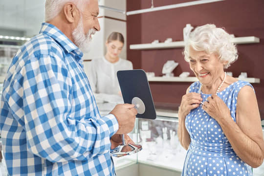 Careful Senior Man Buying Luxury Necklace At Jewelry Store