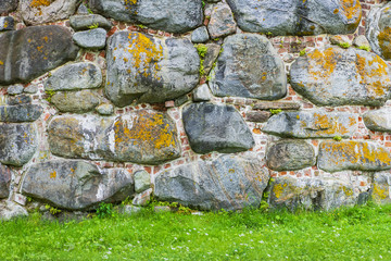 Medieval fortress- brick stone wall. Outdoor architecture- vintage rock