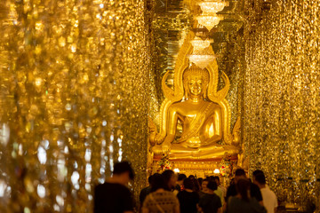 [Wihan Kaeo] Chantaram Temple or Tha Sung Temple, Beautiful Golden Buddha statue inside Wihan Kaeo or glass sanctuary, Famous place in UTHAI THANI, THAILAND.