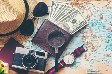 Top view of Traveler accessories and items man with black for planning travel vacations on the world, copy space. Travel and Summer holiday concept