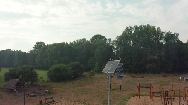 Flight over a deca square with solar panels in Poland. Aerial shot in Photovoltaic solar panels absorb sunlight as an energy source for generating electricity, creating sustainable energy. 
