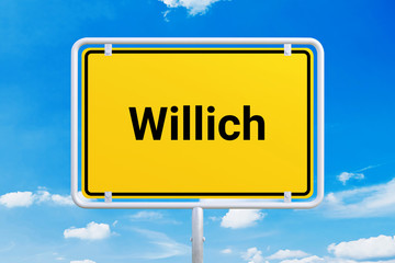 Stadt Willich. Gelbes Schild, Ortsschild, Ortseingangsschild. Himmel mit Wolken.