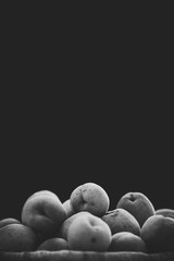 Fresh ripe apricots on an black background