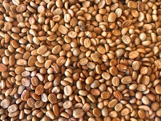The left shell of roasted coffee seed on the table