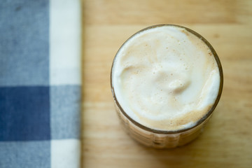 Milk foam on iced beverage