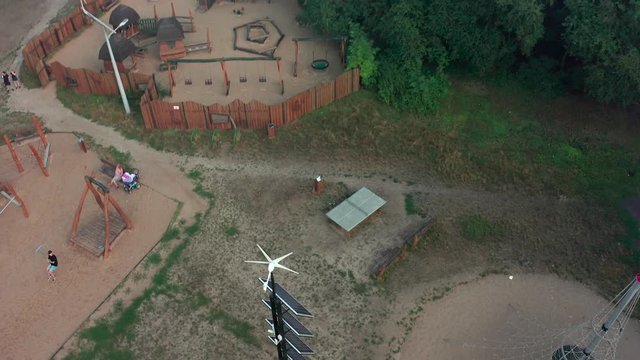 Flight over a deca square with solar panels in Poland. Aerial shot in Photovoltaic solar panels absorb sunlight as an energy source for generating electricity, creating sustainable energy. 