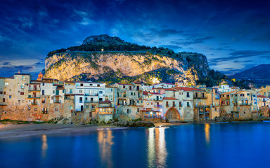 Fototapeta na wymiar Sunset view of beautiful Cefalu, small resort town on Tyrrhenian coast of Sicily, Italy