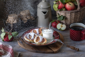 Fresh homemade pancake with apples, honey and cinnamon