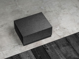 Black rectangular box mockup packaging on the concrete floor