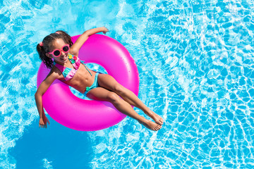 happy girl and smiling in the pool