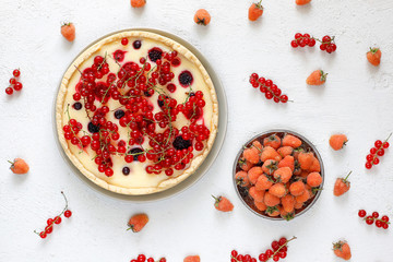 Homemade summer berry tar pie,different berries,golden raspberry,blackberry,red currant,raspberry,black currant,top view