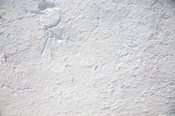 Close-up texture of white stone  old wall.  Santorini Greece.