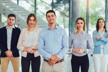 Fototapeta premium Group of happy business people and company staff in modern office, representing company