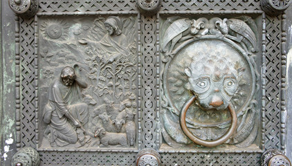 View of the detail of St. Peter's Cathedral, beautiful stone decoration with door handle in the historical center, Bremen, Germany