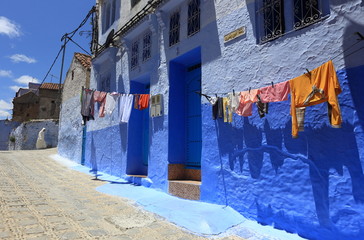 Blue street walls of the popular city of Morocco, Chefchaouen. Traditional moroccan architectural details.