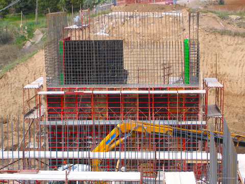 Formwork for walls made of concrete. Construction of the walls in elevation of the shoulders of a road bridge