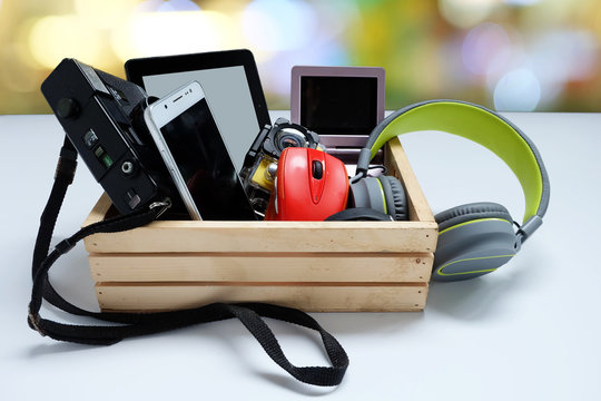 Many used modern Electronic gadgets for daily use in wooden cases on white background, Reuse and Recycle concept