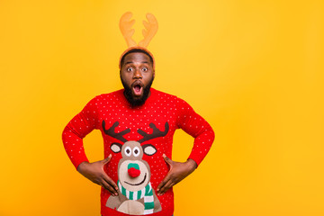 Portrait of his he nice attractive cheerful cheery amazed funky guy wearing Santa look outfit style touching tummy stomach isolated over bright vivid shine yellow background