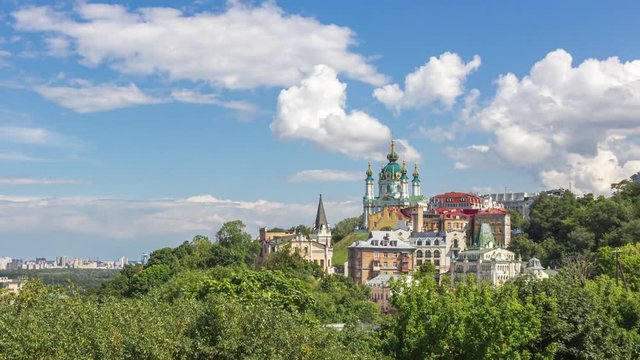 Famous St. Andrew’s Church and panorama of Kyiv city in Ukraine, time lapse motion up