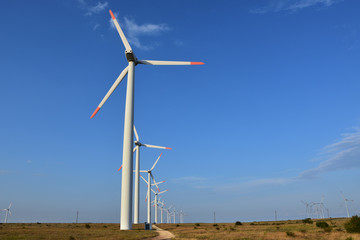 Wind generators in the fields near Kaliakra Cape, Bulgaria. Renewable energy. Sustainable energy resource