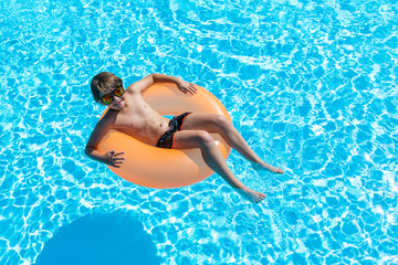 child smiling happily in the pool