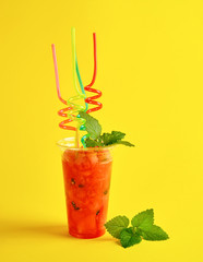 smoothie from ripe red watermelon in a plastic cup