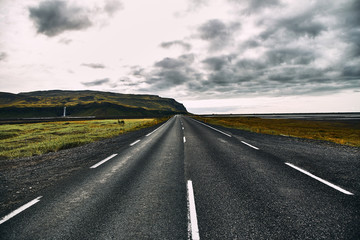Naklejka premium Beautiful road in the incredible landscapes of Iceland