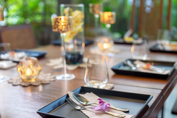 Dinner set on the wood table with long wine glass