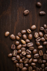 Close-up coffee beans on a dark wood background