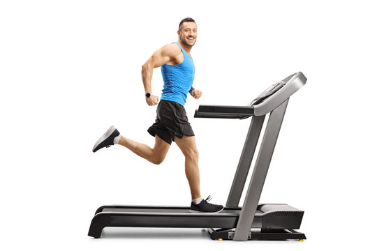 Male Athlete Running Fast On A Treadmill