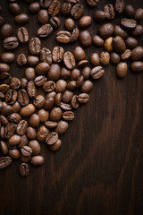 Close-up coffee beans on a dark wood background