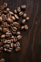 Close-up coffee beans on a dark wood background