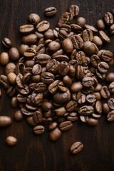 Close-up coffee beans on a dark wood background