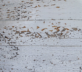 wooden surface covered with white chipped paint