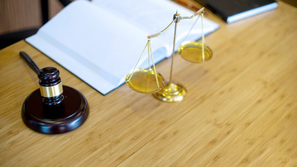 gavel and balance on the table with book
