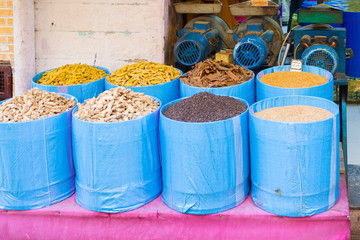 Sacks of spices at a stall in a bazaar in Tangier in Morocco