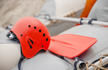 Helmet and paddle for kayaking. Extreme sport concept on mountain river