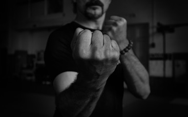 Close-up of hand of martial artist for a fight. Concept. Strong arms