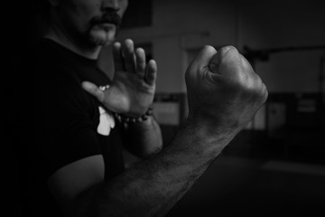 Close-up of hand of martial artist for a fight. Concept. Strong arms