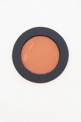 Round decor element on a light plastered wall