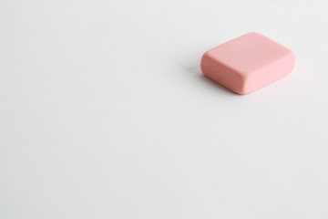 pink eraser on colorful background