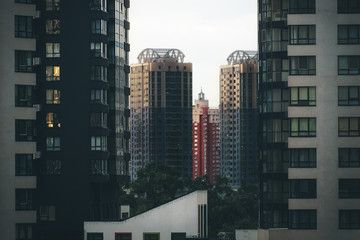Fototapeta premium Skyscraper through the frame of buildings in the kyiv, ukraine