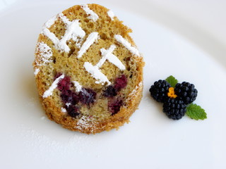 blackberry cupcake on a white background