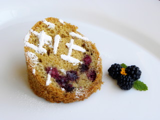blackberry cupcake on a white background
